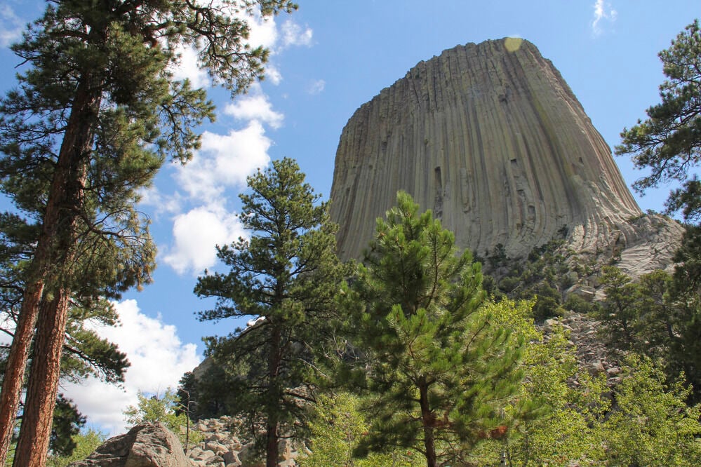 Emergency responders at Devils Tower conducting a rescue operation, assisting an injured climber after a fall