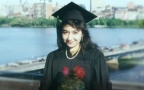 Aafia Siddiqui, a Pakistani woman, in a solemn expression, highlighting her story of legal struggles and imprisonment.