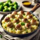 Turkey Meatballs with Lemony Rice served in a skillet with garnished parsley and lemon wedges